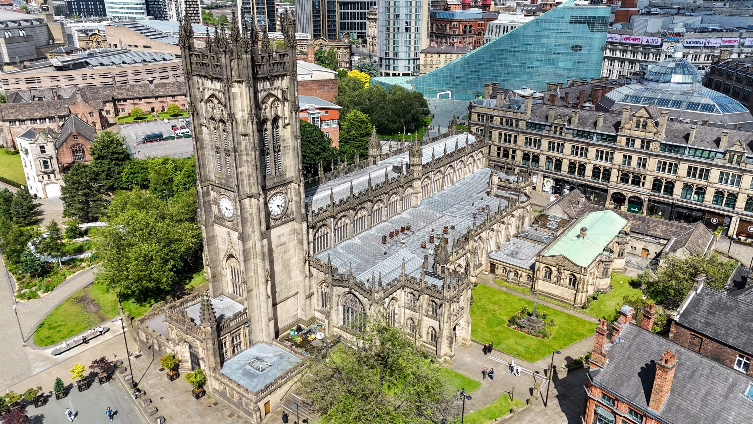 Manchester Cathedral with the National Football Museum and city centre skyline