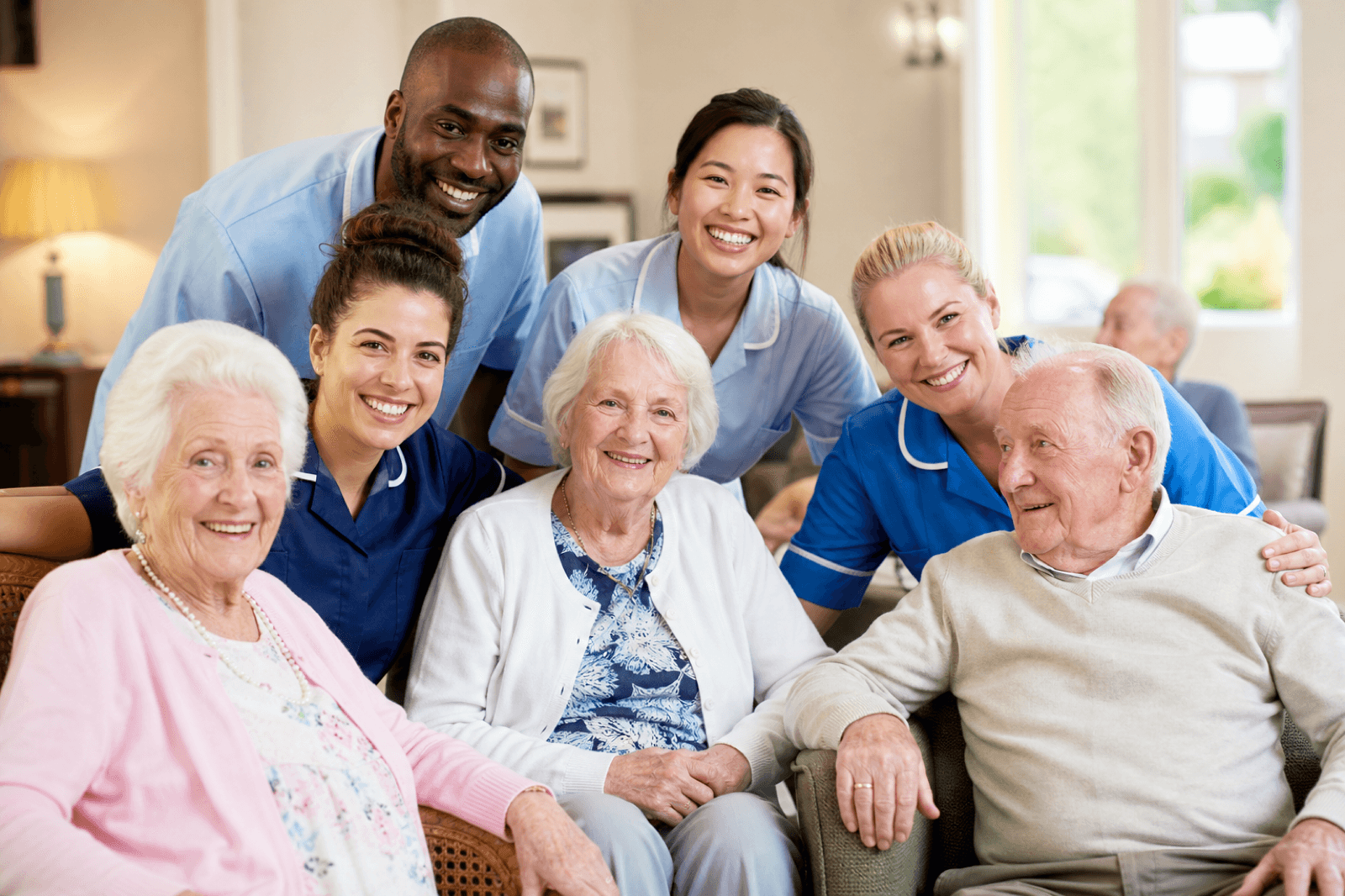 Healthcare staff team supporting residents alongside care home team members